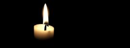 Горящая свеча в темноте