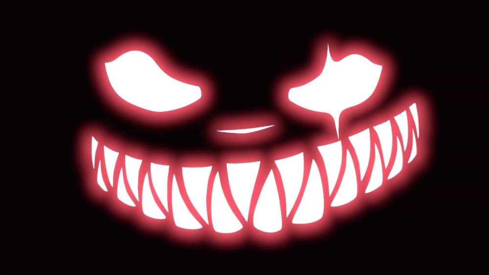 Страшная улыбка на черном фоне