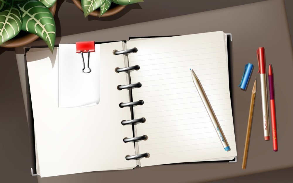 Открытый блокнот с ручкой
