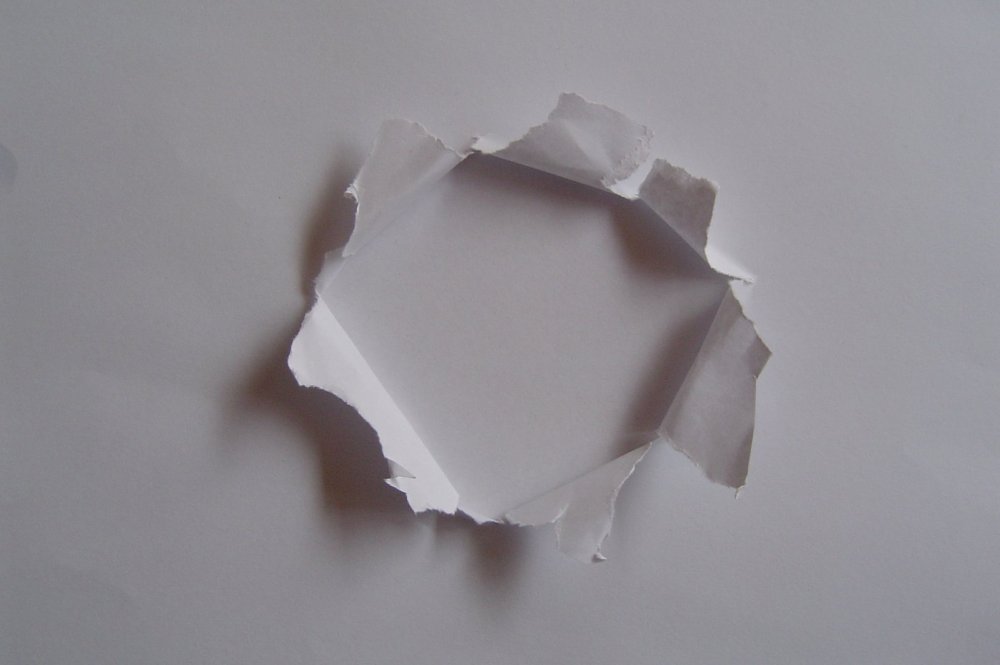Текстура дырка в бумаге