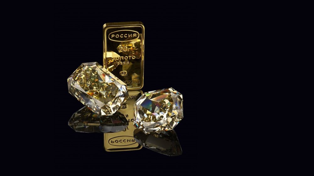 Слиток золота на черном фоне