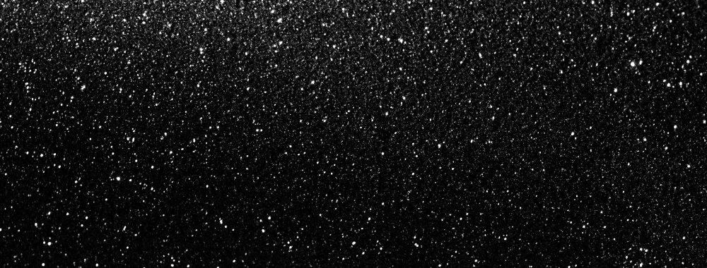 Серебряные блестки на черном фоне