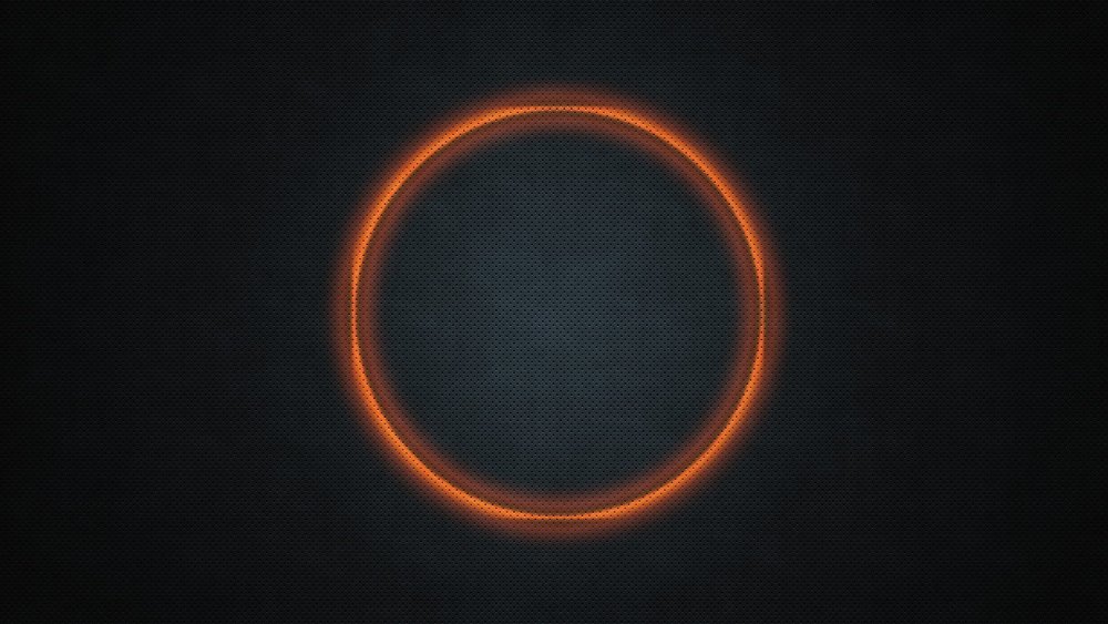 Оранжевый круг на черном фоне