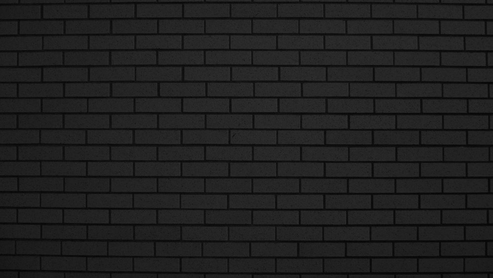 Темно серая кирпичная стена