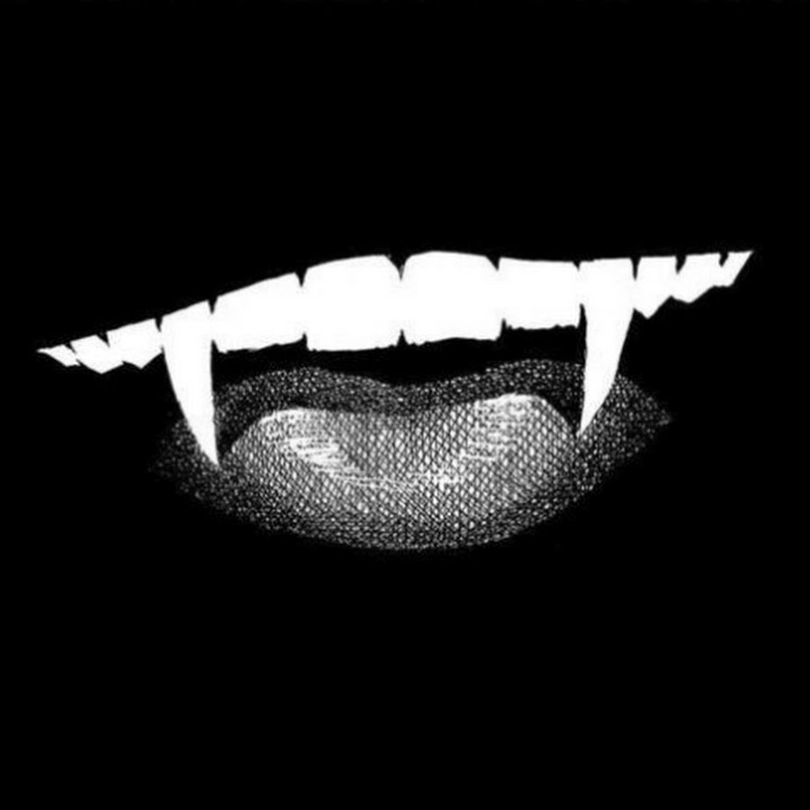 Клыки на черном фоне