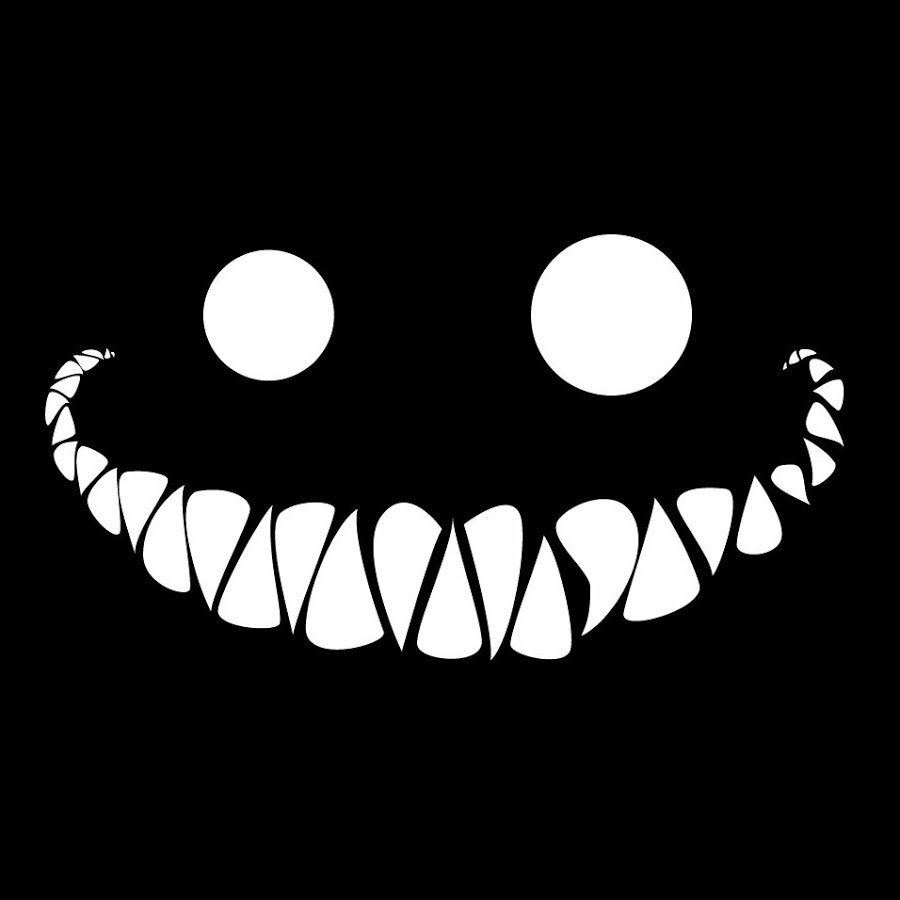 Острые зубы на чёрном фоне