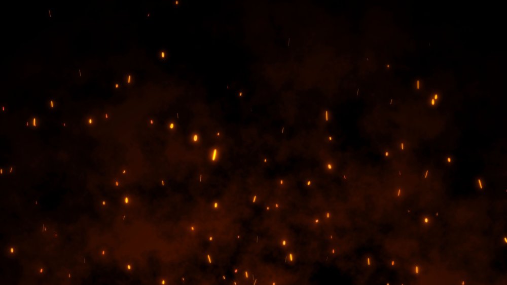 Искры и дым на черном фоне