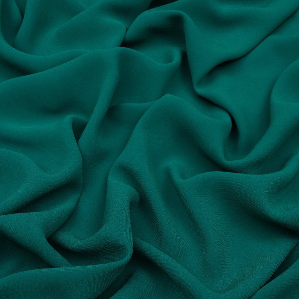 Темно зеленая ткань