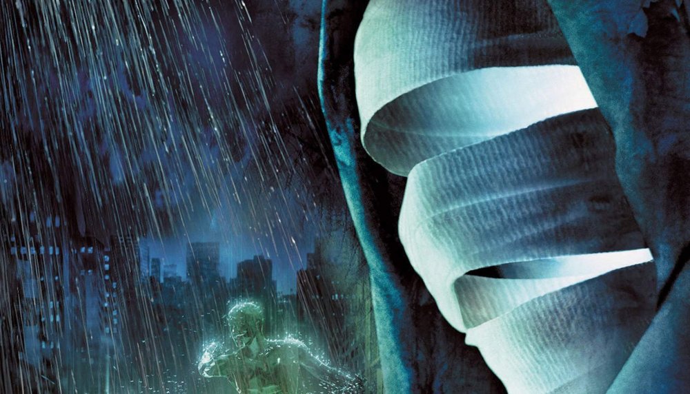 Мужчина в плаще и шляпе