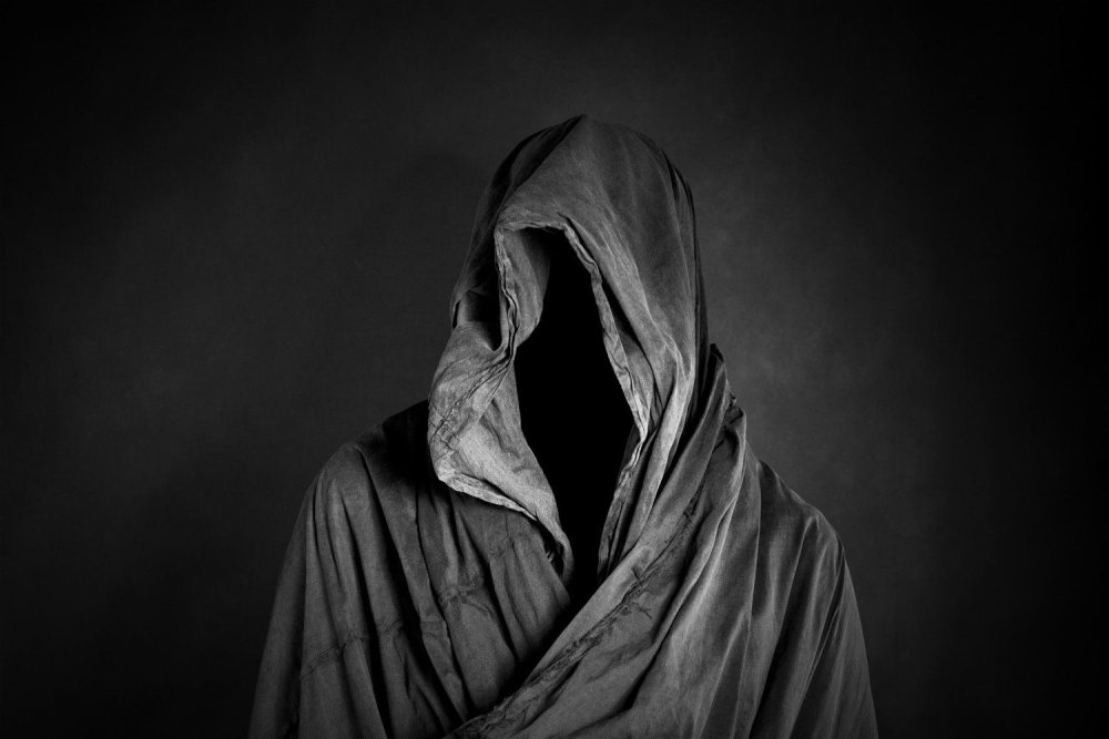 Путник в плаще