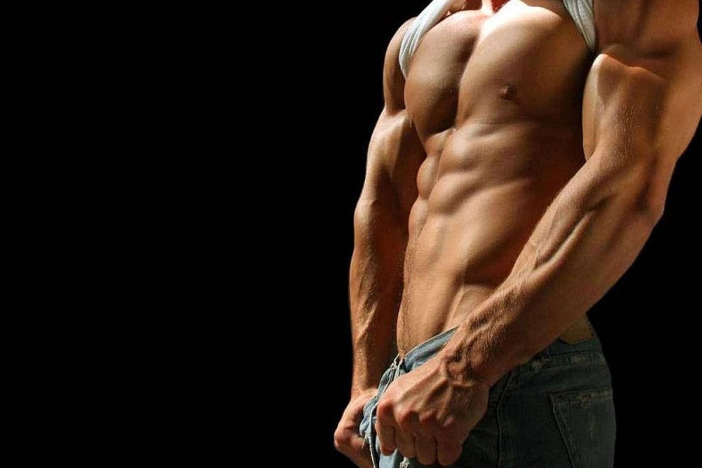 Мужское тело на черном фоне