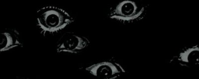 Много глаз на темном фоне